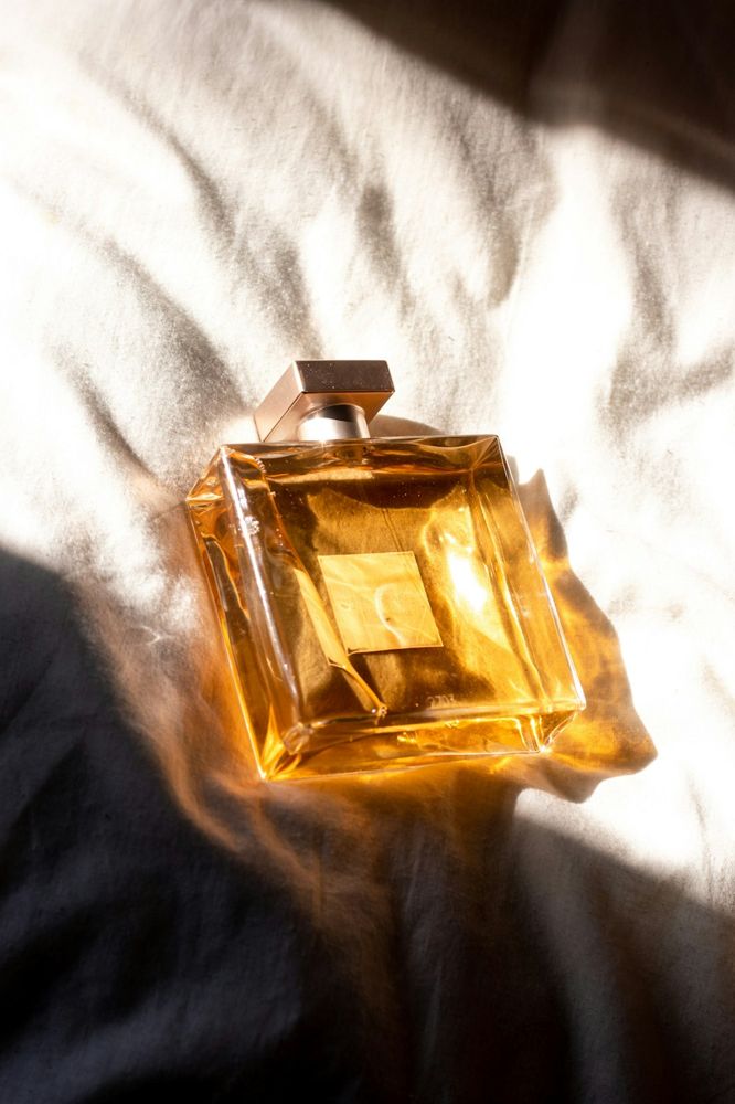 Golden perfume bottle in sunlight