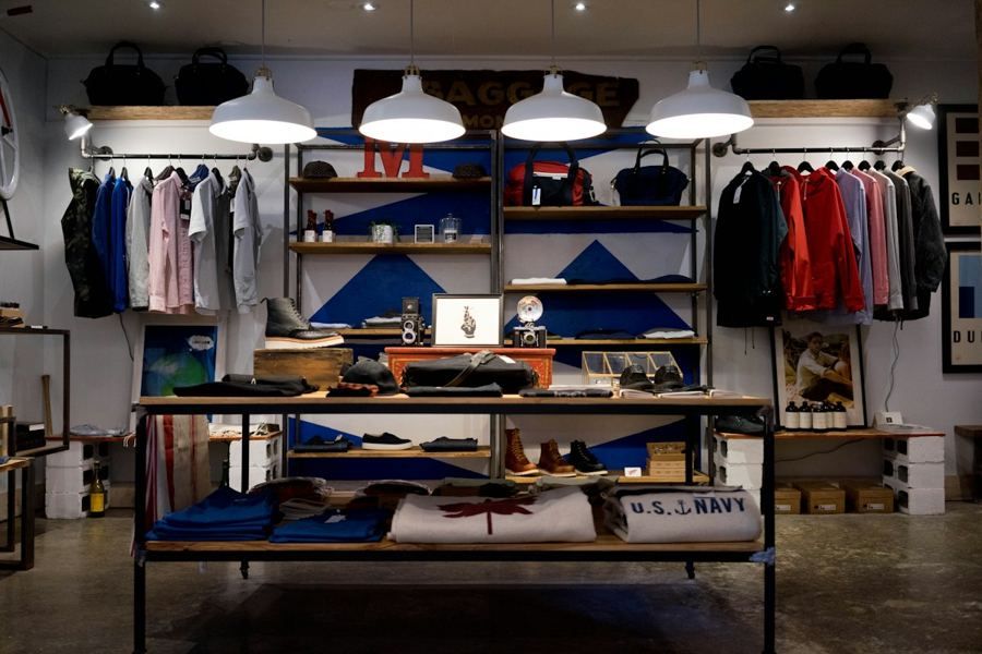 A fashion store interior with racks of clothing